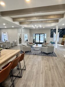 Edgewater Pointe Apartments Interior Modern Living Room with tables and chairs wide view in Biloxi, MS
