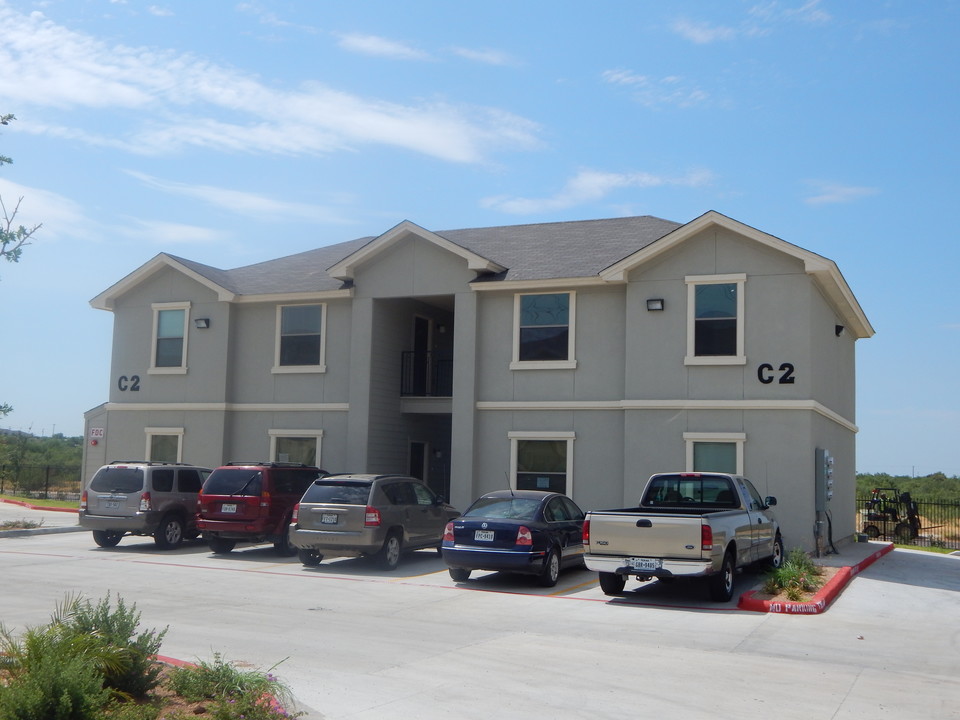 La Joya Apartments Exterior Apartment Buildings with Parked Cars and Trucks View in Laredo, Texas