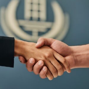 Real Estate Manager and Property Manager Shaking Hands